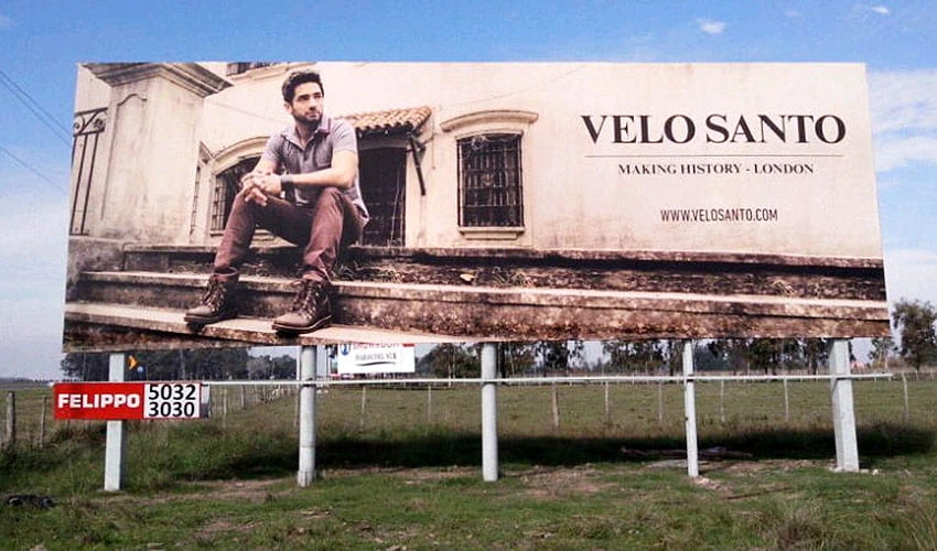 Cartel publicitario de gran formato de Velo Santo en Ruta 2
